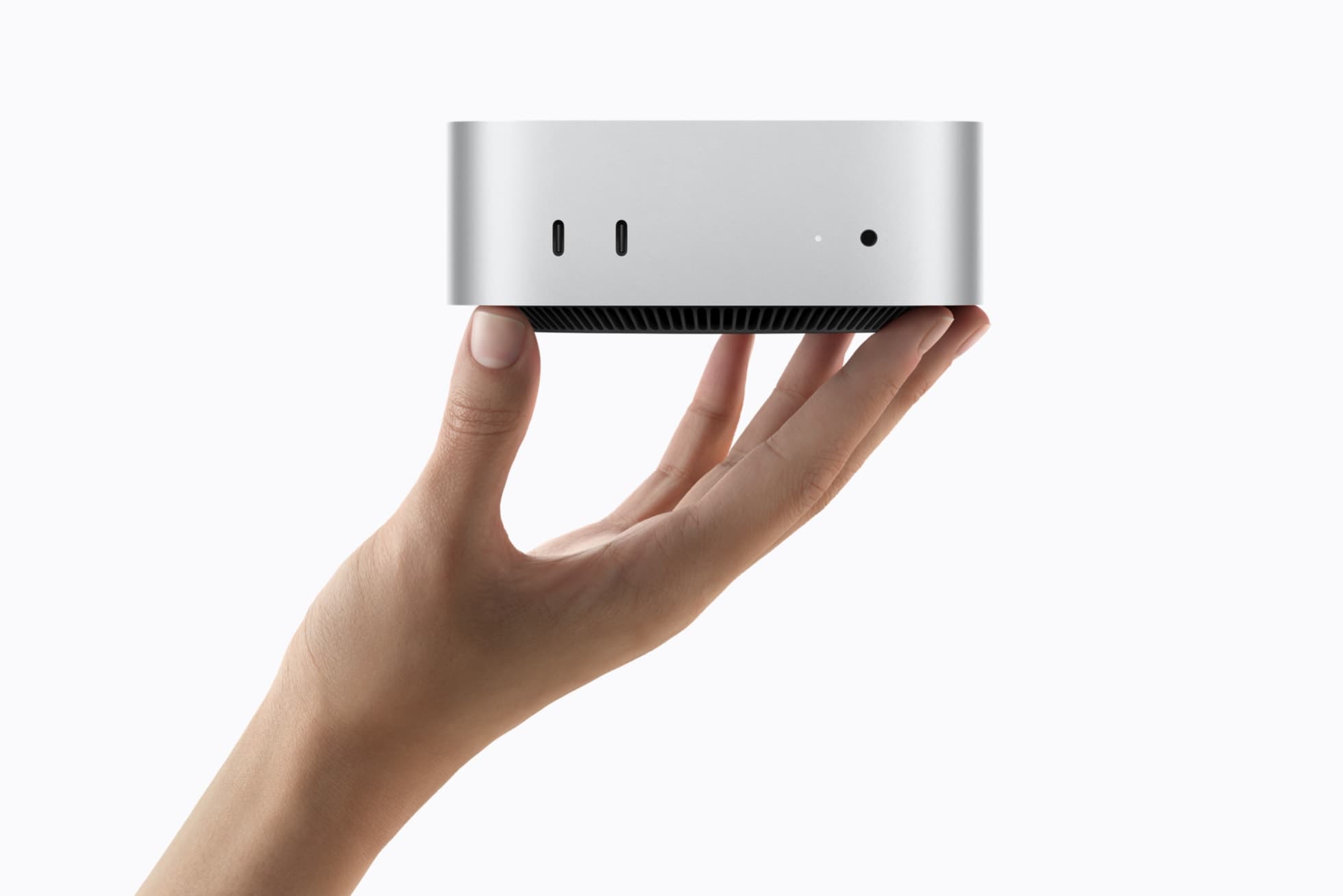Mac mini prateado visto de cima, com o logotipo da Apple na tampa